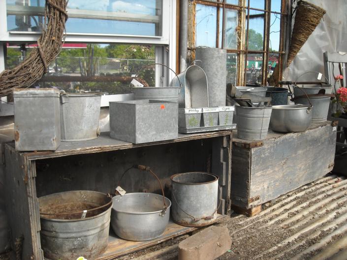 Large assortment of vintage metal containers for plants